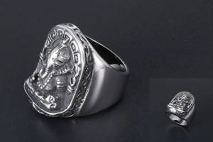 Macro detail of vintage silver Ganesha relief carving on heavy titanium steel ring