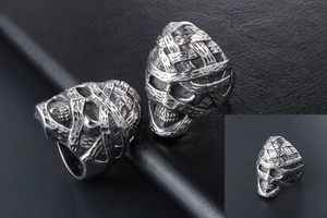 Detailed close-up of punk mummy skull ring showing aged silver finish and bandage texture