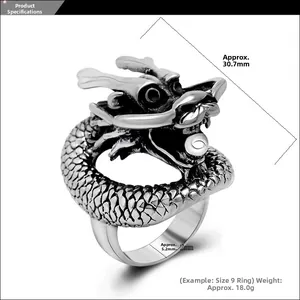 Detailed view of vintage dragon ring with measurements showing height and band width