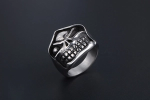 Macro view showing the detailed gothic skull structure and polished inner surface of the ring