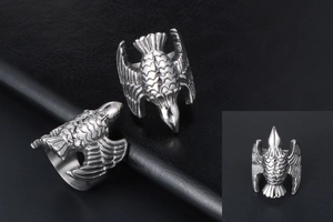 Macro view of vintage eagle ring detailing the fine feather textures on silver steel band