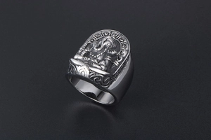 Detailed relief of vintage Ganesha deity on stainless steel ring with antique finish