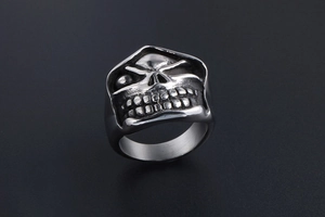 Macro shot of polished skull ring featuring black oxidized details in gothic punk style