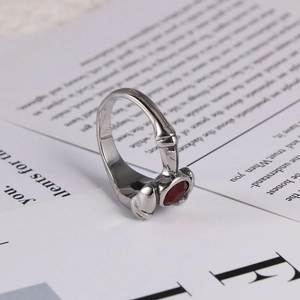 Gothic silver stainless steel ring with red ruby gemstone and bone claw design