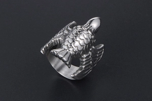 Detailed macro view of vintage flying bird ring showing intricate silver feather textures