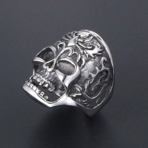 Retro stainless steel skull ring with intricate flame and dragon carved patterns for men
