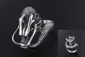 Detailed view of vintage dragon head ring with intricate scales and antique silver finish