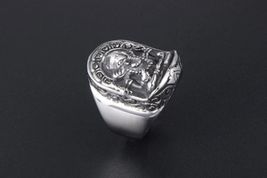 Detailed relief of Ganesha on a vintage titanium steel men's ring with floral engraving