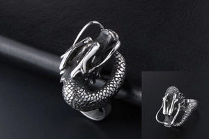 Detailed macro view of retro stainless steel dragon ring with 3D embossed scales and textures