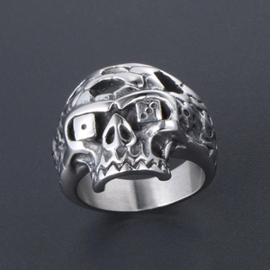 Punk style stainless steel skull ring with dice eyes and chain texture on black base