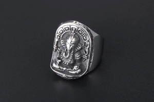 Detailed close-up of retro titanium steel Ganesha ring with intricate religious relief
