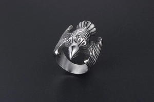 Detailed close-up of eagle ring showing feather textures and brushed inner metal band