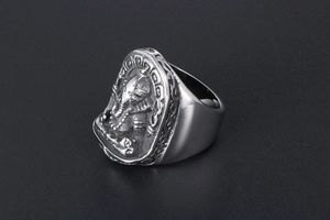 Macro shot of vintage titanium steel Ganesha ring with detailed elephant head relief