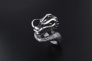 Macro detail of retro stainless steel dragon ring showing intricate 3D scale textures
