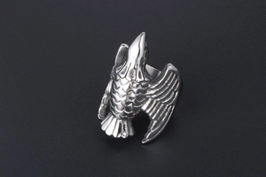 Macro detail of vintage eagle ring in stainless steel with detailed feather engraving