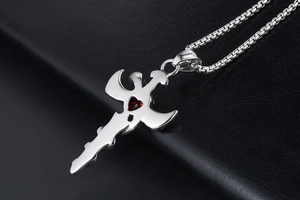 Detail of gothic sword pendant in titanium steel with red heart zircon and box chain
