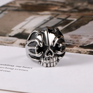 Polished silver punk skull ring in stainless steel for men from a 45-degree angle