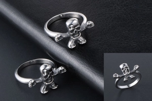 Macro detail of silver stainless steel skull ring with movable robot-like design