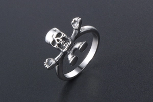 Detailed macro shot of vintage gothic skull ring in polished silver stainless steel