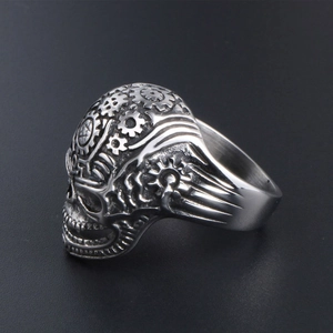 Vintage steampunk skull ring featuring intricate gear designs and antique steel finish