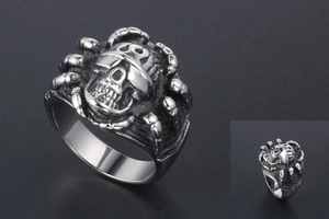 Detailed view of Gothic skull ring with mechanical spider legs in vintage steel