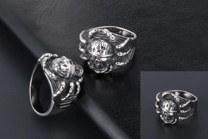 Detailed views of vintage skull ring featuring silver and black punk textures