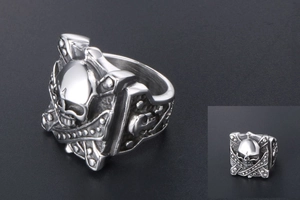 Macro shot of vintage silver skull ring with gothic 3D skull and rivet details