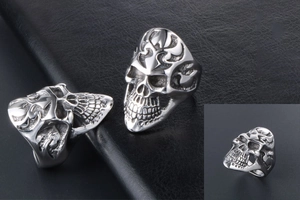 Macro view of punk skull ring in titanium steel featuring intricate flame carvings