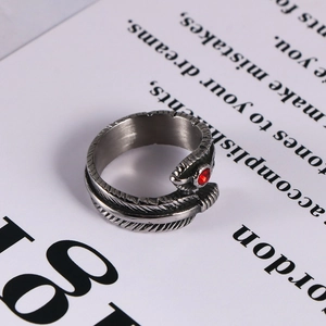 Gothic feather ring for men in titanium steel featuring a red gemstone center stone