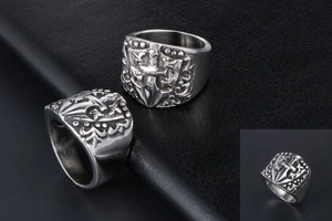 Macro view of vintage punk knight ring featuring engraved sword and shield patterns