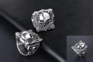 Detailed close-up of retro punk skull rings with intricate gothic engravings on leather