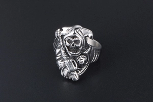 Detailed view of skull grim reaper relief on silver stainless steel punk ring