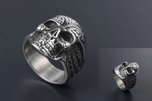 Macro view of vintage skull ring with gothic engravings and aged silver finish texture