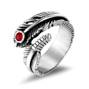 Gothic feather ring in vintage titanium steel with a vibrant red gemstone accent