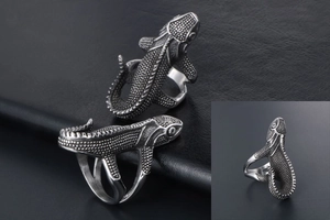 Macro shot of vintage silver lizard ring showing detailed scale texture and punk style