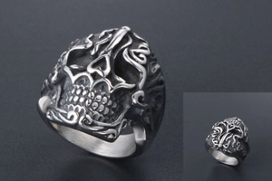 Detailed view of skull ring featuring heart-shaped nose and intricate vintage patterns