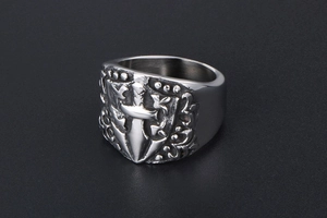 Detail of medieval shield and sword carving on retro stainless steel punk style ring