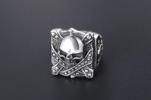 Macro detail of punk gothic square skull ring with vintage silver titanium steel finish
