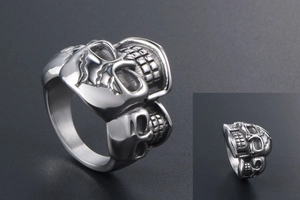 Detailed close-up showing the intricate gothic skull carvings on a punk titanium steel ring