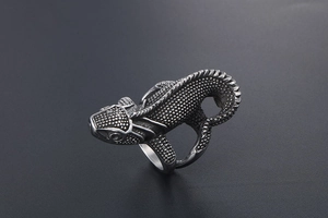 Detailed view of punk style lizard ring with vintage silver finish and scale texture