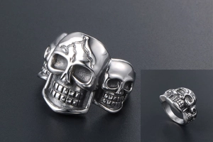 Macro shot of punk style skull ring in vintage silver titanium steel with lightning engravings