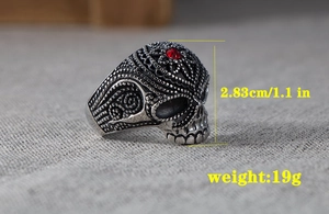 Macro detail of gothic skull ring with red gemstone showing 2.83cm height and 19g weight