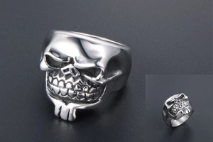 Detailed close-up of a silver skull ring with a realistic beard and gothic steel finish