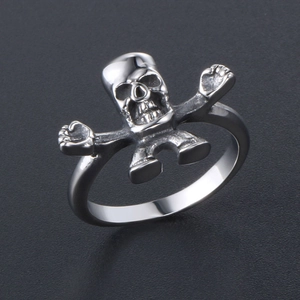 Punk style stainless steel skull ring with dynamic skeleton design and polished finish