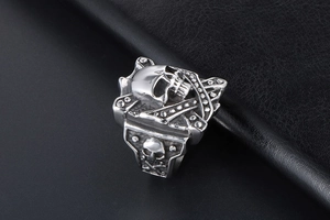 Macro view of punk style square skull ring in silver titanium steel with side carvings