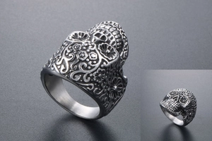 Detailed view of the sugar skull punk ring with intricate floral vine engravings