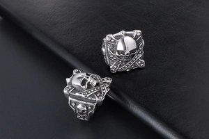 Macro detail of gothic square skull ring in silver titanium steel on black leather