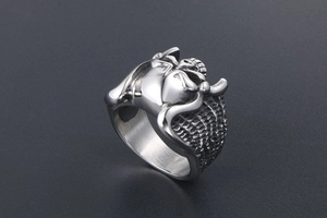 Detailed shot of Gothic skull ring featuring grim reaper scythe and silver steel finish