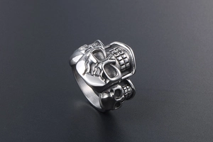 Detailed macro shot of vintage punk skull ring in silver titanium steel with gothic texture