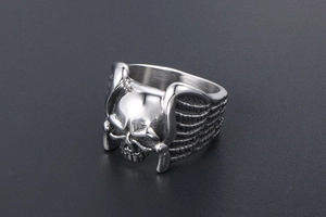 Detailed macro view of punk style skull ring with wing textures in titanium steel